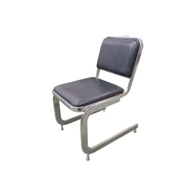 A modern-design side chair, characterised by a continuous cantilevered tubular metal frame with a chrome finish, and a seat and rectangular backrest, both upholstered in dark grey leather or imitation leather; available for hire for events, advertising, films and TV series