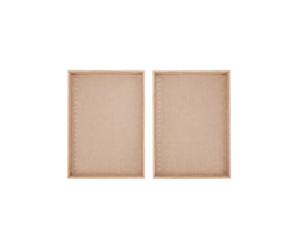 Set of two rectangular display trays, featuring an outer frame made of light-coloured wood and an inner surface lined with textured linen fabric, complete with aligned side perforations; available for hire for events, advertising, films and TV series