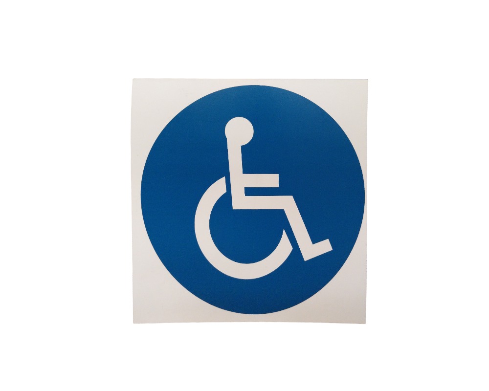 Square information sign, characterised by a clean design featuring a deep blue central circle framing the International Symbol of Accessibility (ISA) in white; available for hire for events, advertising, films and TV series