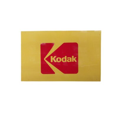 A vintage rectangular advertising sign with a distinctive bright yellow background that highlights the iconic classic Kodak logo, centred within a red block with yellow lettering; available for hire for events, advertising, films and TV series