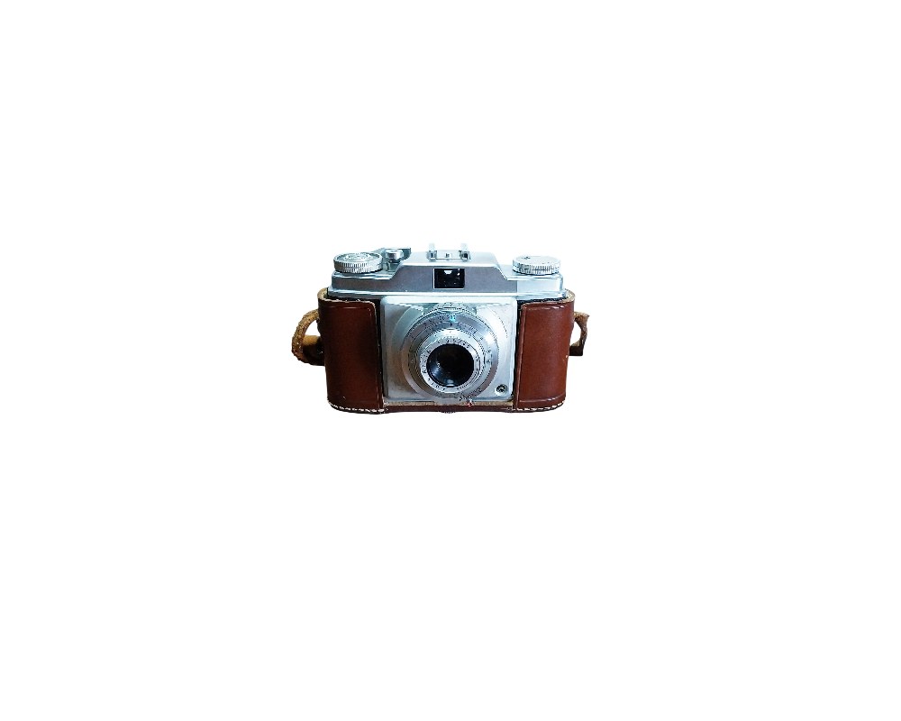 A classic analogue camera with a silver metal body, fitted with a detailed front lens and protected by a vintage brown leather case; available for hire for events, advertising, films and TV series