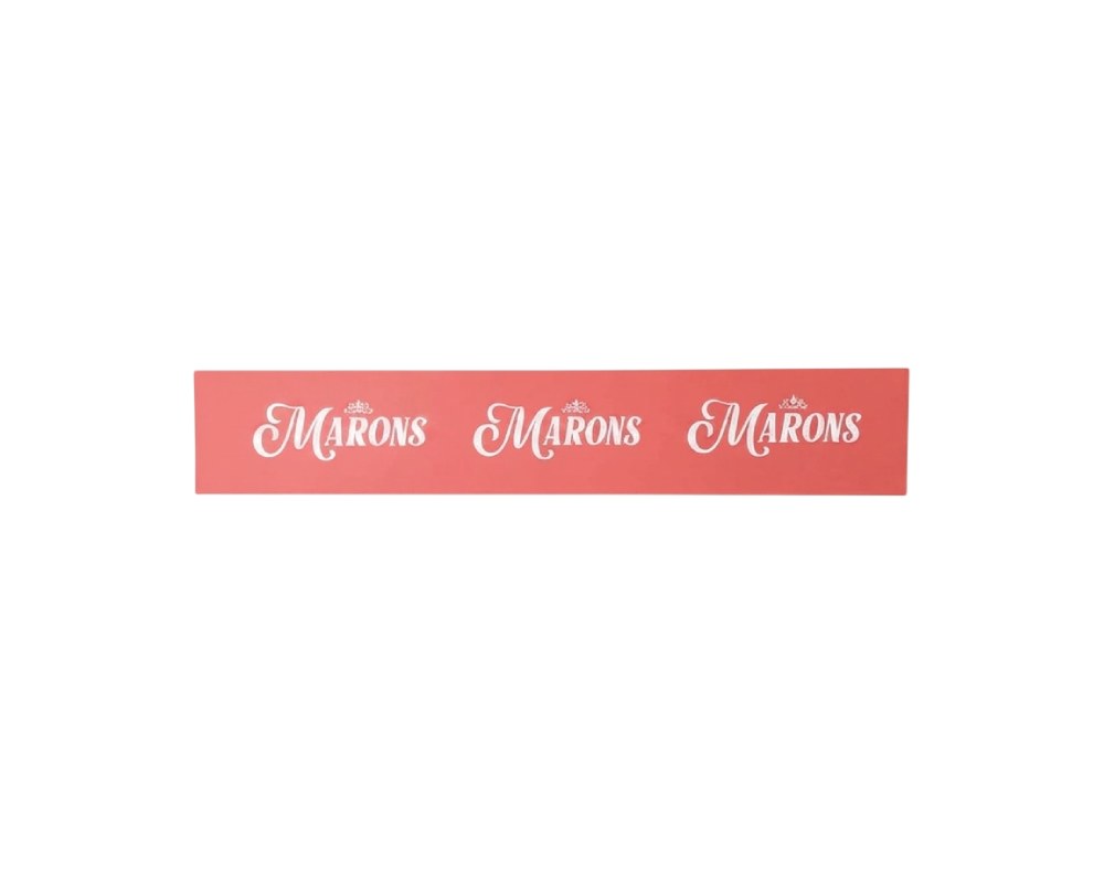 A rectangular sign in a horizontal format with a coral-coloured background and the corporate slogan ‘Marons’ repeated in a light cursive typeface with crown-shaped details at the top. Dimensions: Red: 46x7 Green: 46x16 Blue: 52x12